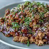 Heaping serving of Korean-style ground turkey over steamed rice, with broccoli florets on the side for a complete meal.