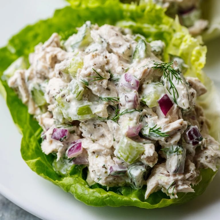 Gluten-free Dill Pickle Chicken Salad Lettuce Cups served chilled, perfect for a light and refreshing lunch.